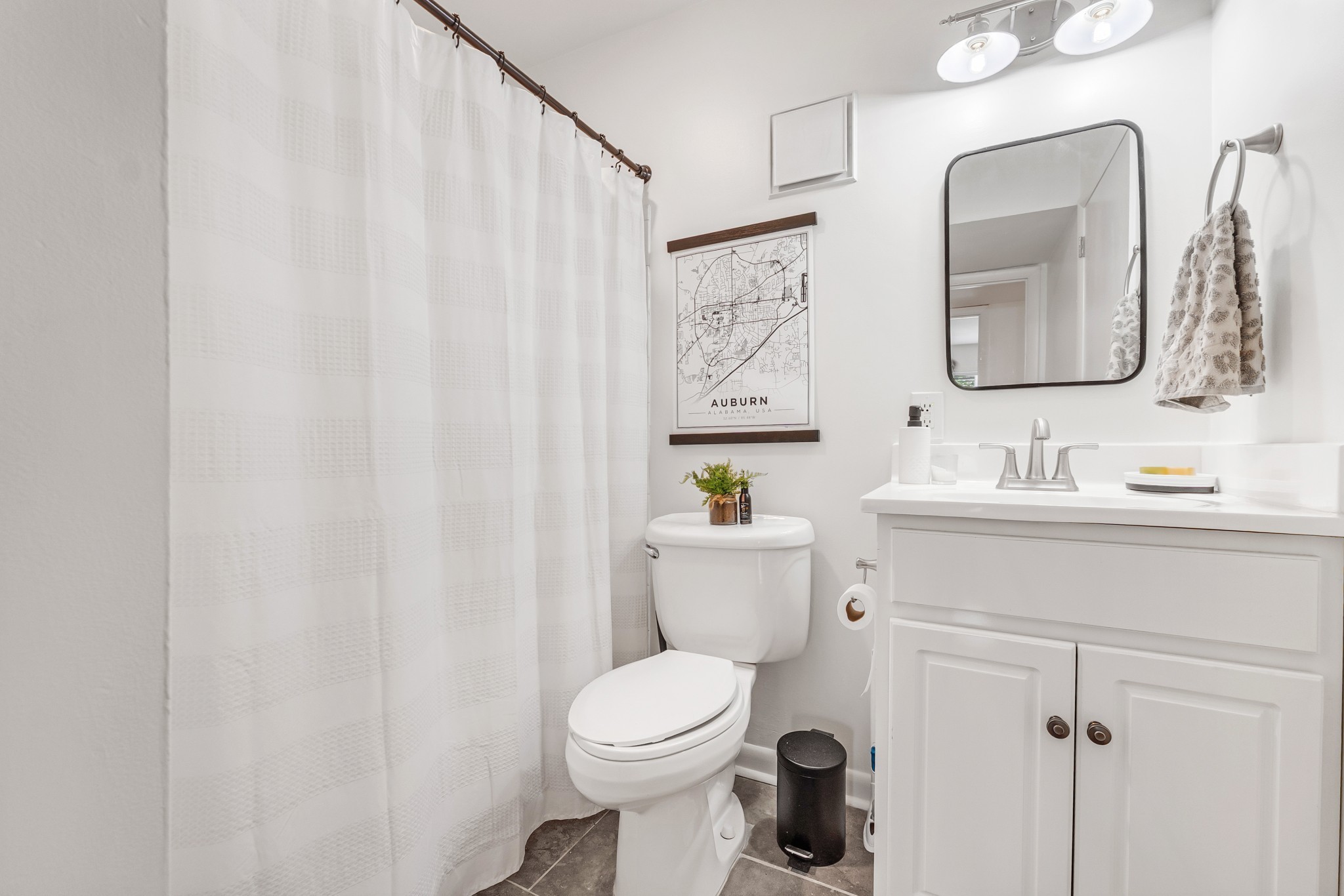 21 Vaughns Gap Road, Unit 88F Nashville, TN 37205 - Photo 26 of 30 a bathroom with a toilet a sink and a mirror