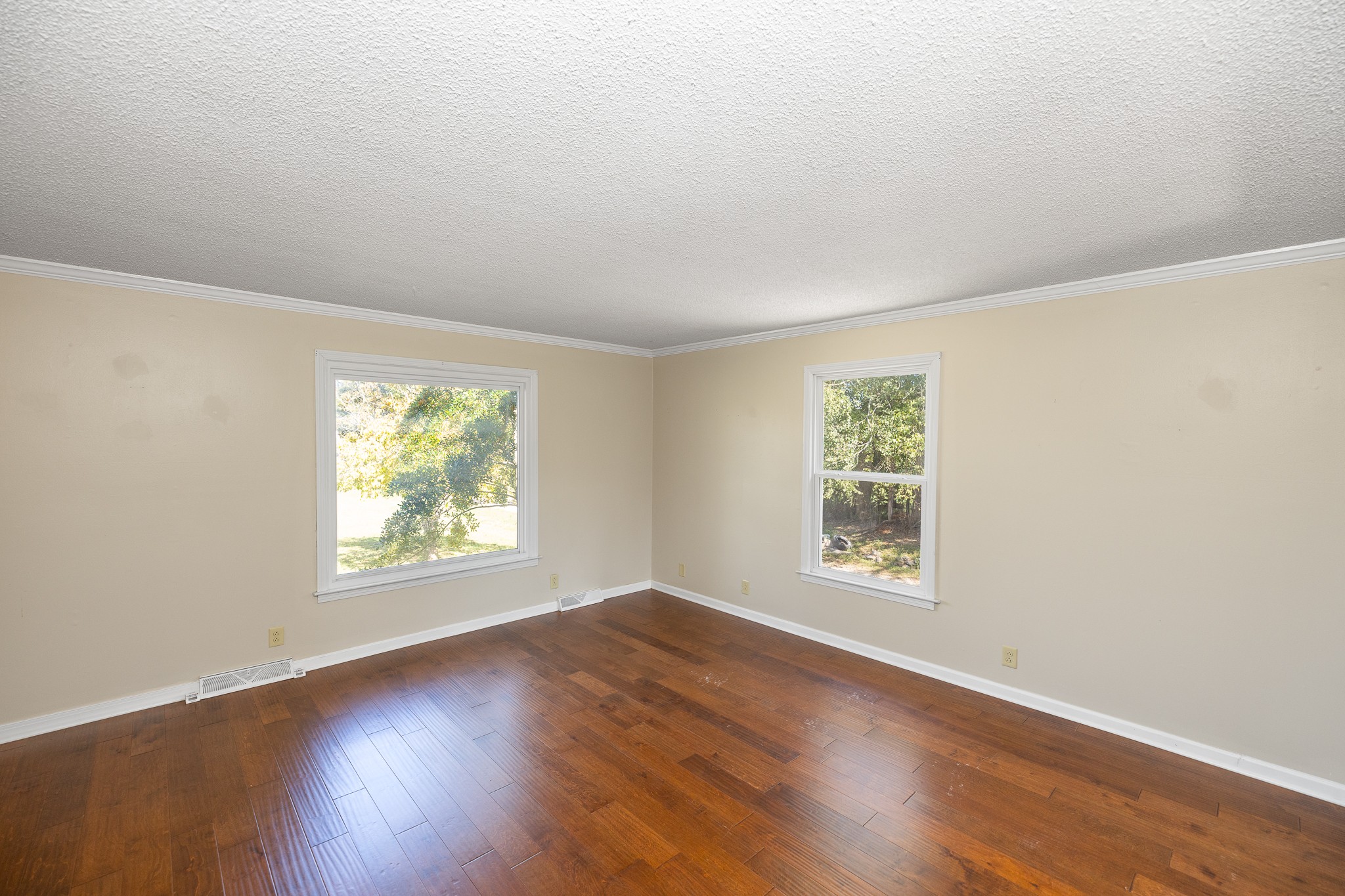100 Philadelphia Road Lebanon, TN 37087 - Photo 15 of 36 an empty room with wooden floor and windows