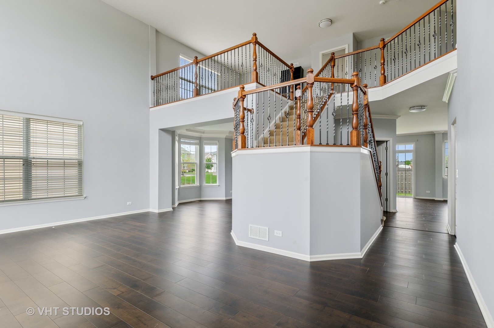 1439 Viola Lane Volo, IL 60073 - Photo 7 of 11 a view of a room with wooden floor and windows