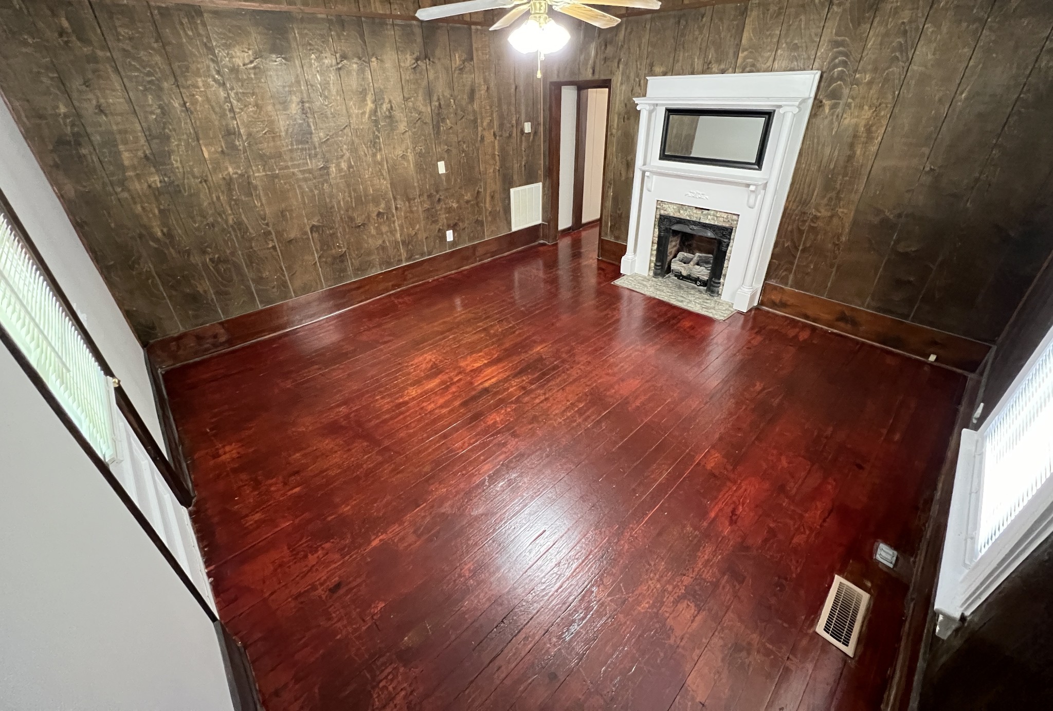 721 North Maple Street, Unit B Murfreesboro, TN 37130 - Photo 4 of 13 a view of an empty room with wooden floor and a window