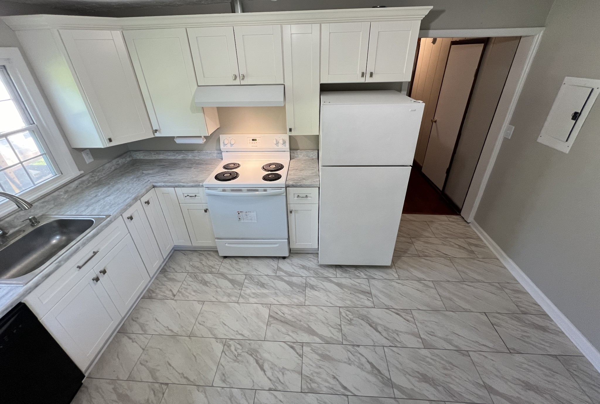 721 North Maple Street, Unit B Murfreesboro, TN 37130 - Photo 6 of 13 a kitchen with cabinets and a refrigerator