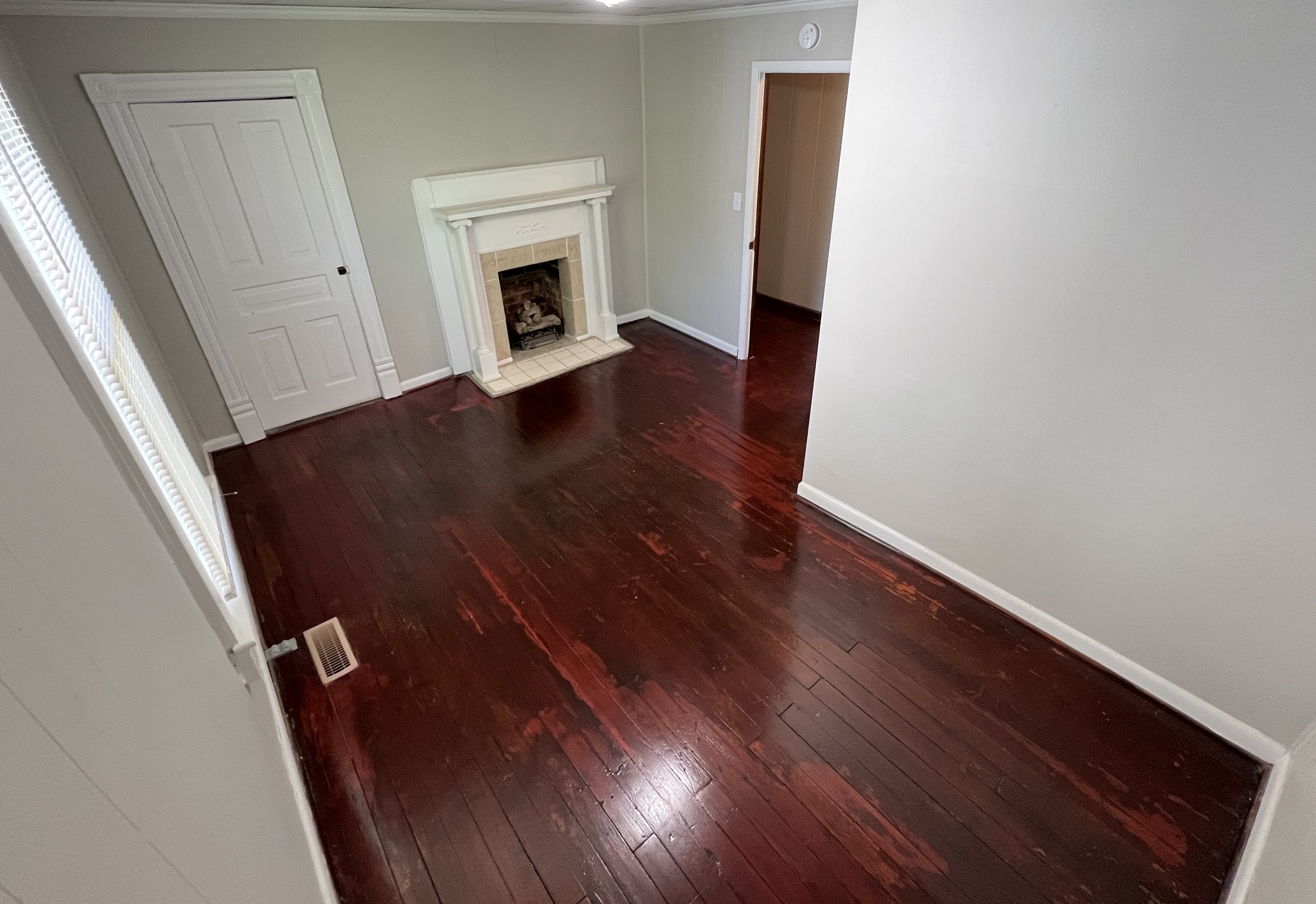 721 North Maple Street, Unit B Murfreesboro, TN 37130 - Photo 9 of 13 wooden floor in an empty room with a fireplace