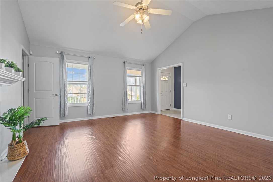 115 Shelby Street Spring Lake, NC 28390 - Photo 9 of 40 a view of an empty room with wooden floor and a window