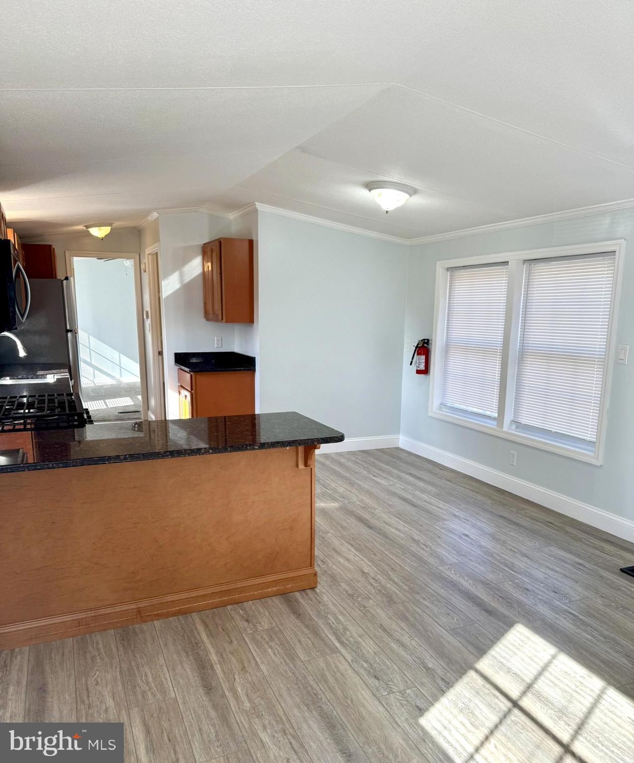 1616 North Main Street Williamstown, NJ 08094 - Photo 12 of 39 an empty room with wooden floor and windows