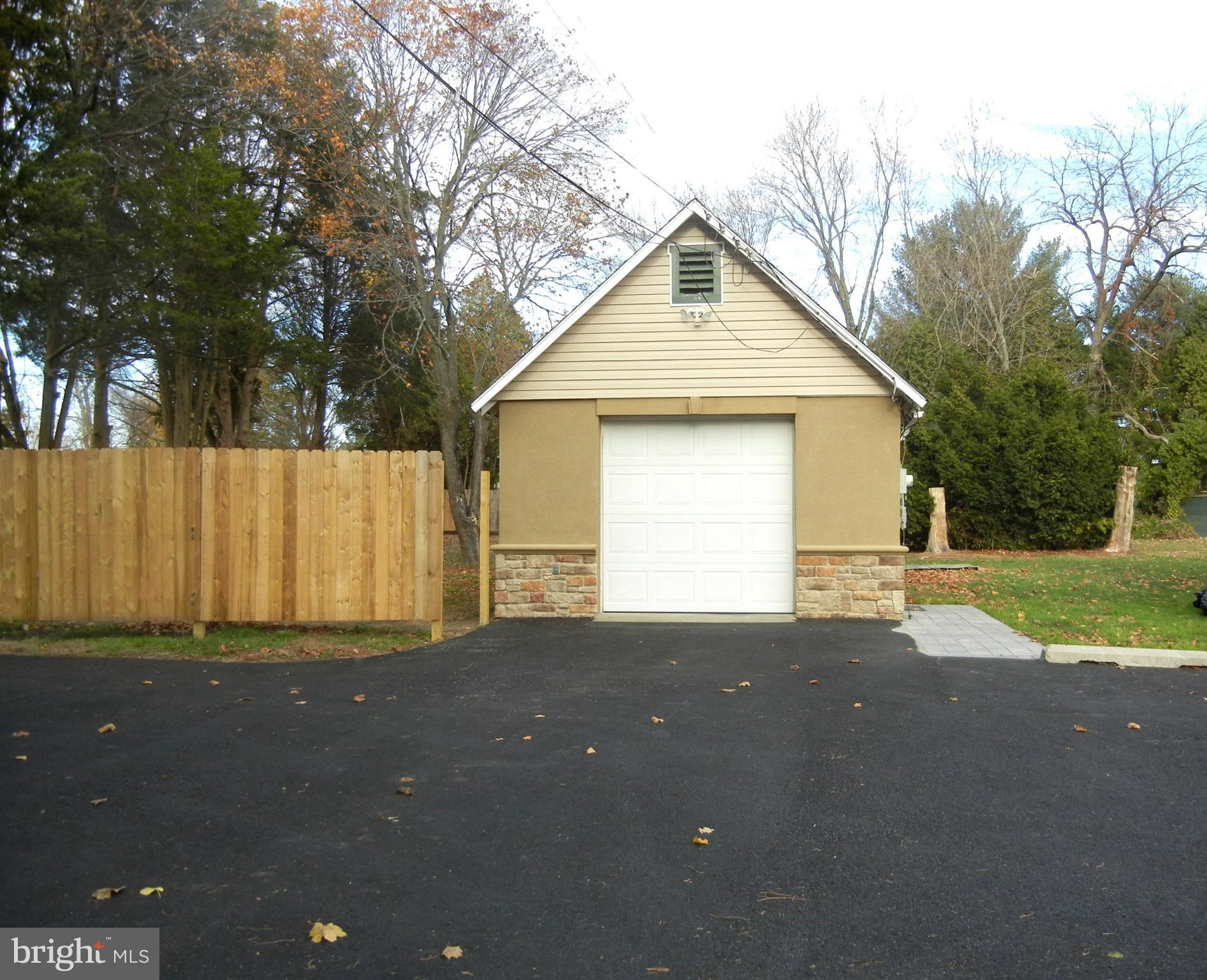 1616 North Main Street Williamstown, NJ 08094 - Photo 2 of 39 a front view of a house with a yard and garage