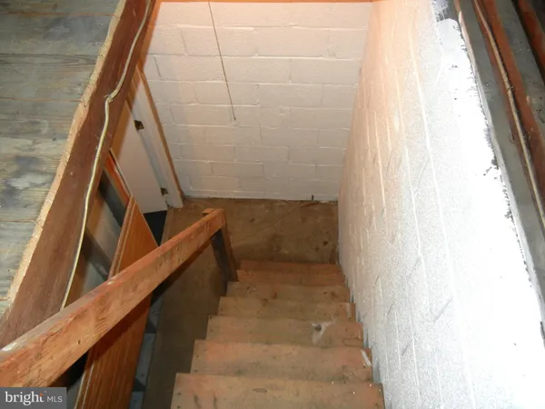 a view of a room with wooden walls