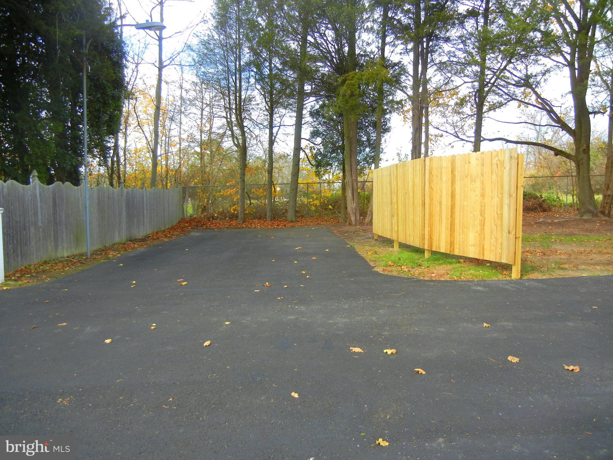 1616 North Main Street Williamstown, NJ 08094 - Photo 37 of 39 a view of backyard with tree and wooden fence
