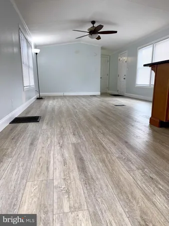 a view of a livingroom with wooden floor