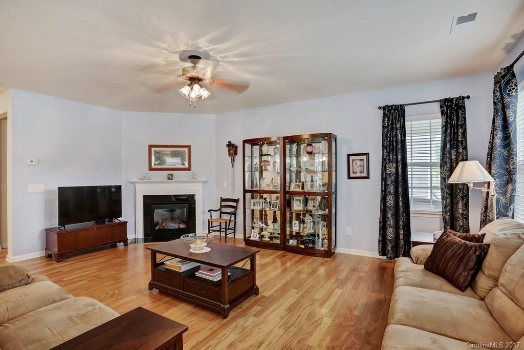 4135 Perth Road, Unit 374 Indian Land, SC 29707 - Photo 16 of 24 a living room with furniture fireplace and flat screen tv
