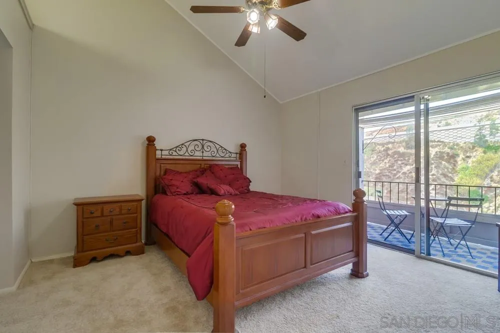 8701 Spring Canyon Drive Spring Valley, CA 91977 - Photo 11 of 24 a bed sitting in a bedroom next to a window