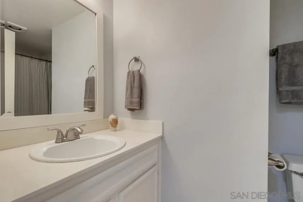 8701 Spring Canyon Drive Spring Valley, CA 91977 - Photo 16 of 24 a bathroom with a sink and a mirror