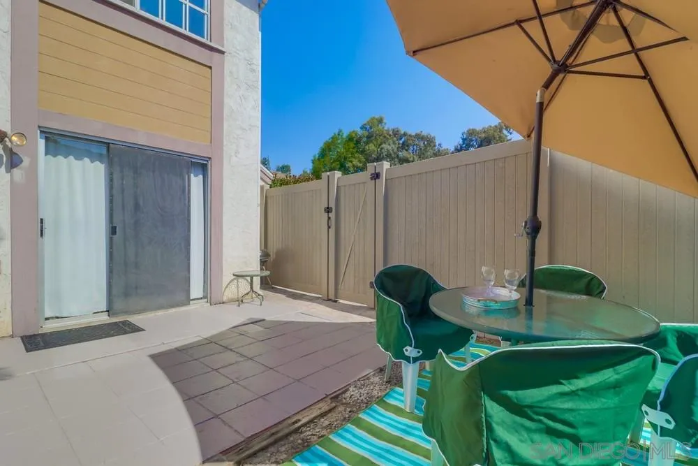 8701 Spring Canyon Drive Spring Valley, CA 91977 - Photo 19 of 24 a backyard of a house with table and chairs
