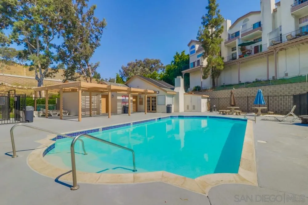 8701 Spring Canyon Drive Spring Valley, CA 91977 - Photo 21 of 24 a view of a house with a swimming pool
