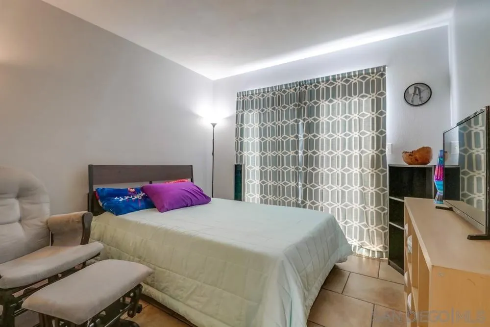 8701 Spring Canyon Drive Spring Valley, CA 91977 - Photo 9 of 24 a bedroom with a bed and walk in closet