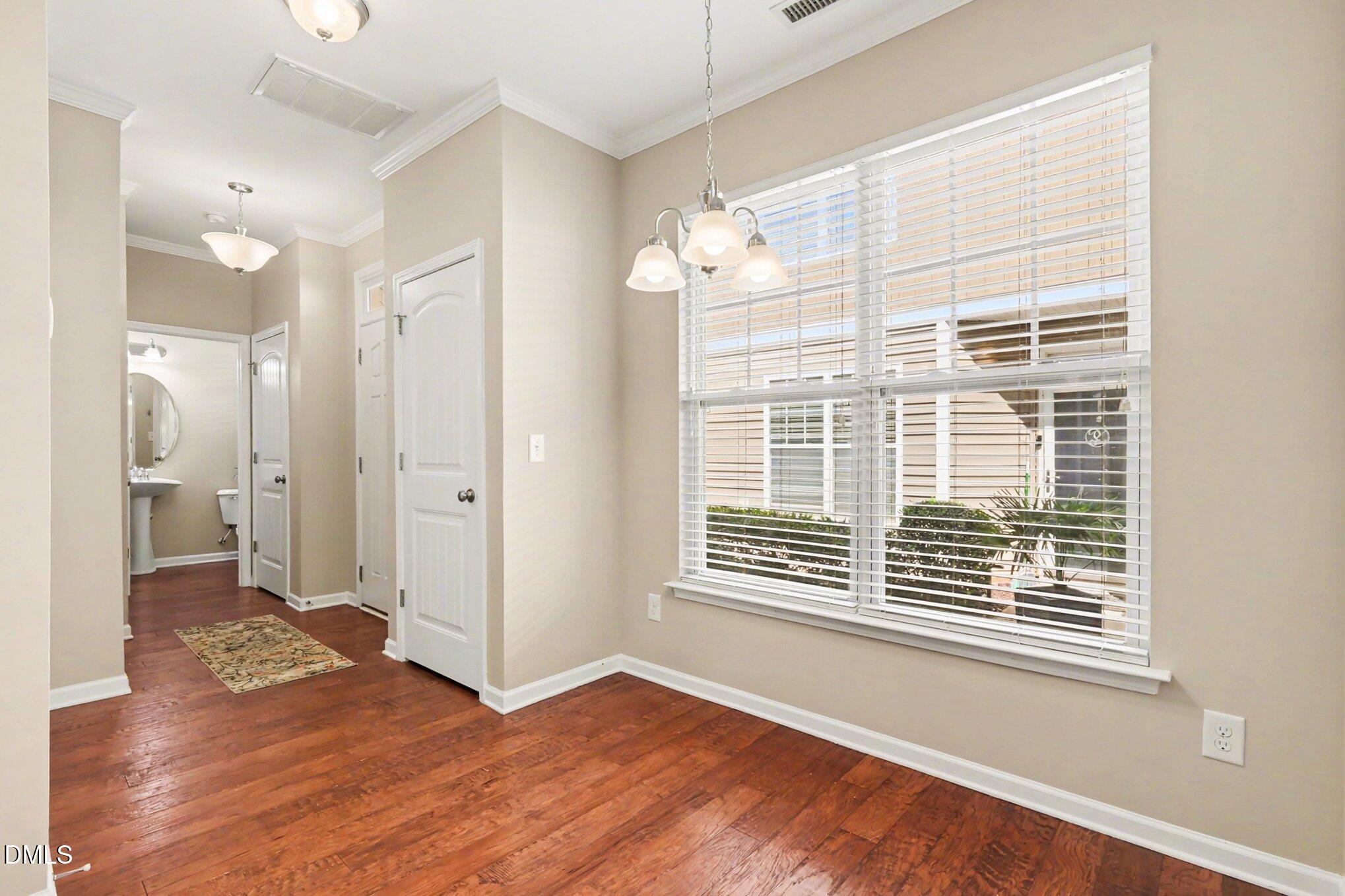 2409 Memory Ridge Drive Raleigh, NC 27606 - Photo 13 of 36 a view of livingroom with natural light and hardwood floor