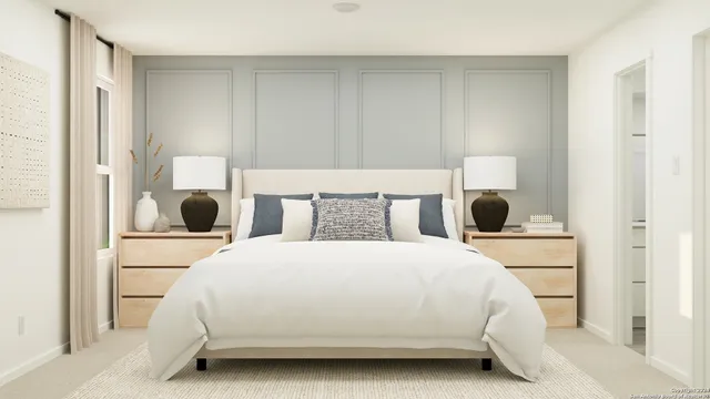 a bedroom with a bed and cabinets