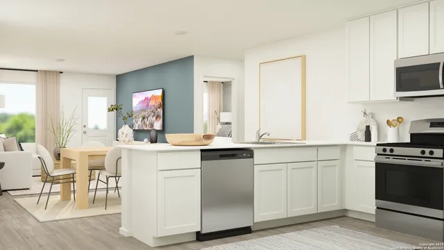 a kitchen with white cabinets and a sink