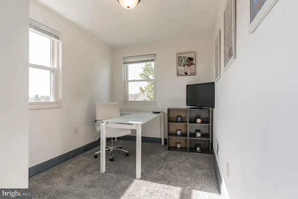 a view of a workspace with a window and workspace