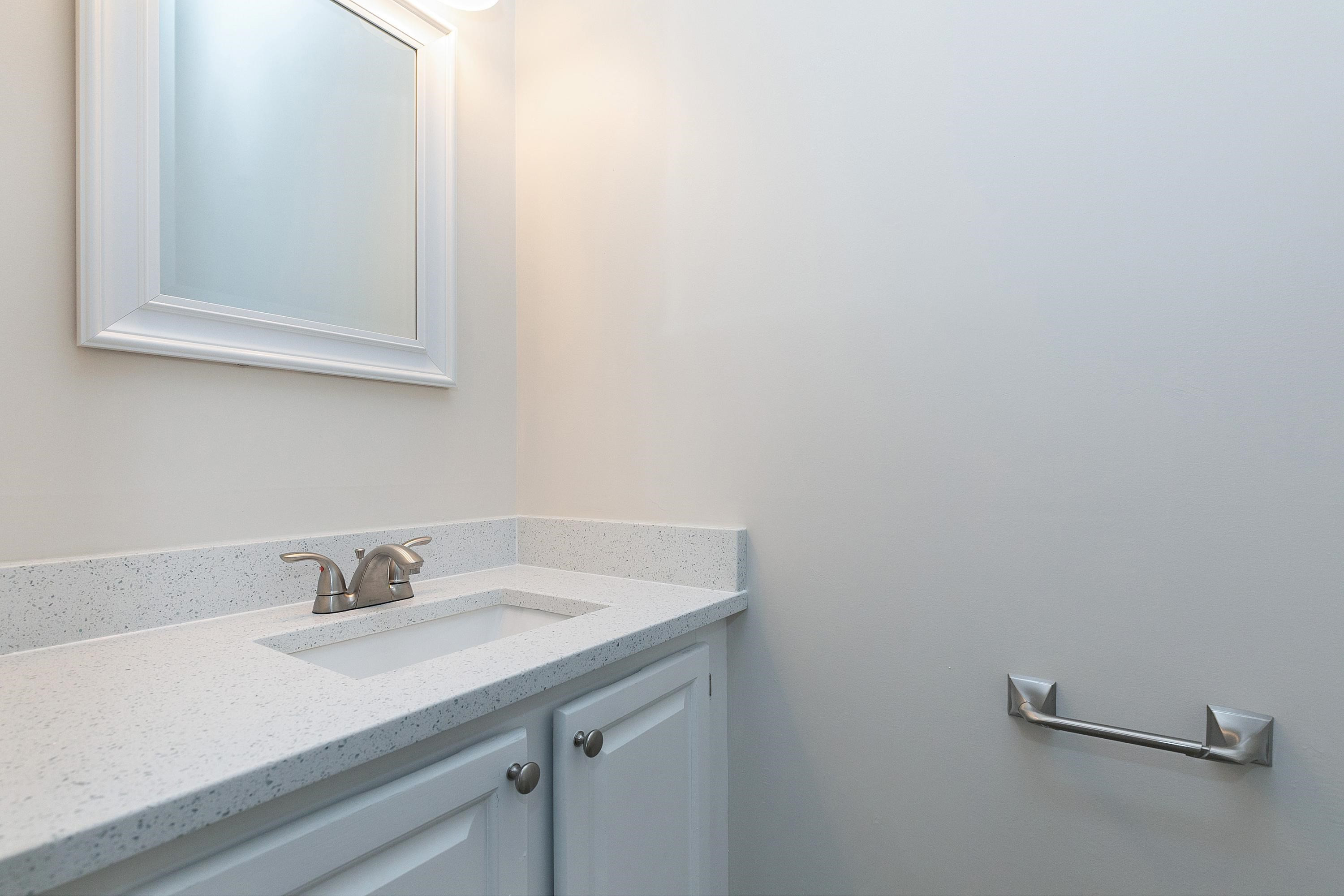 4424 Still Pines Drive Raleigh, NC 27613 - Photo 16 of 34 a bathroom with a sink and a mirror