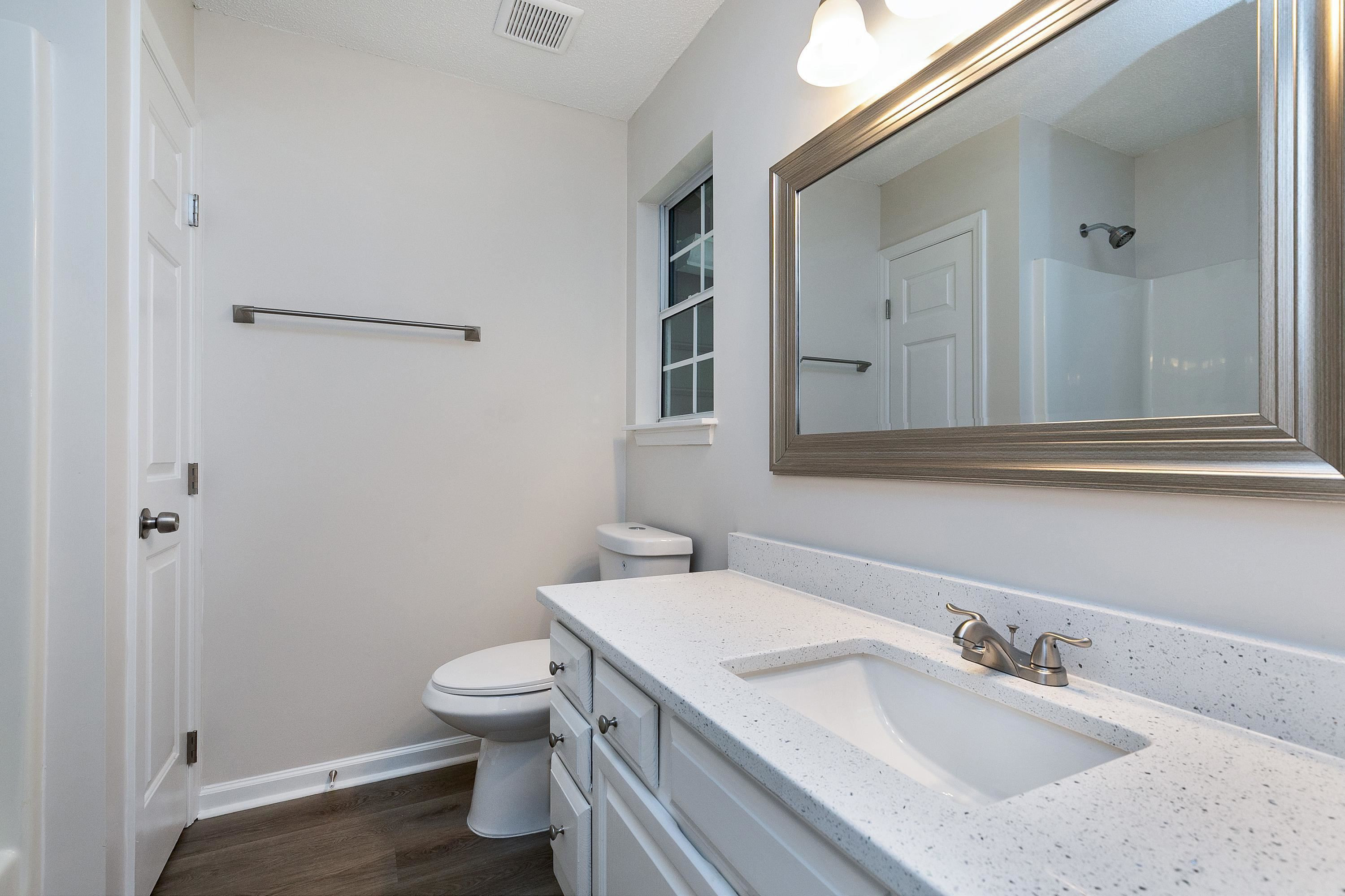 4424 Still Pines Drive Raleigh, NC 27613 - Photo 25 of 34 a bathroom with a sink toilet and shower