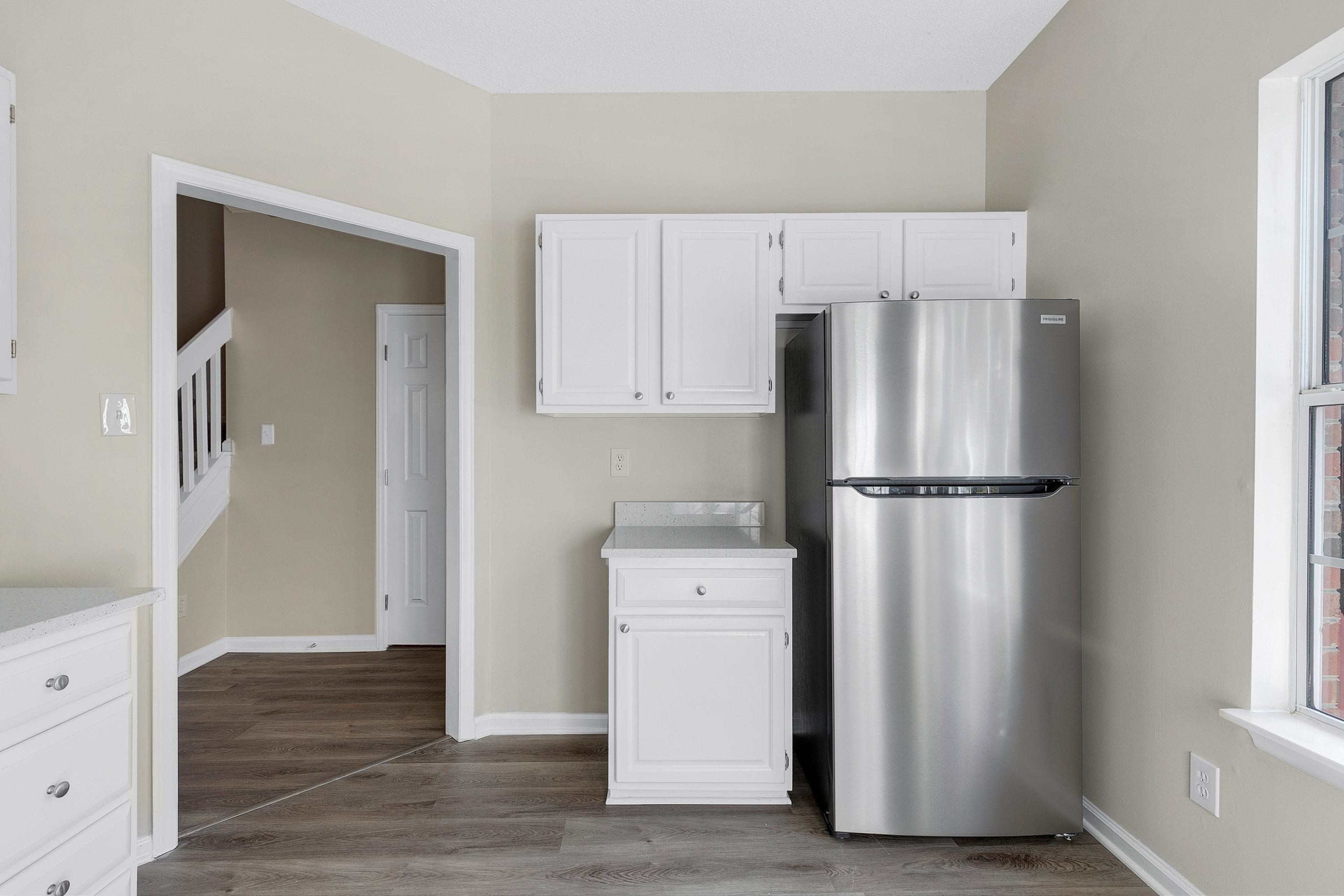 4424 Still Pines Drive Raleigh, NC 27613 - Photo 9 of 34 a kitchen with cabinets and stainless steel appliances