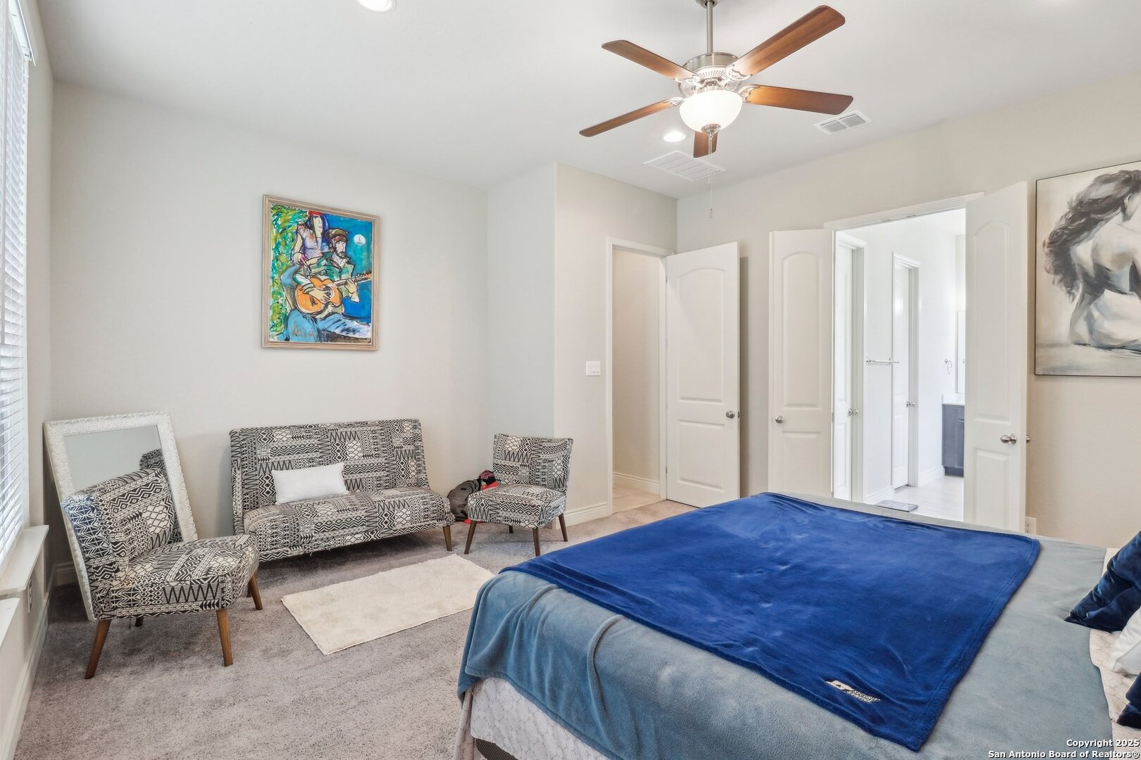 28115 Baldacci Vista Boerne, TX 78015 - Photo 13 of 18 a spacious bedroom with a bed and a chandelier