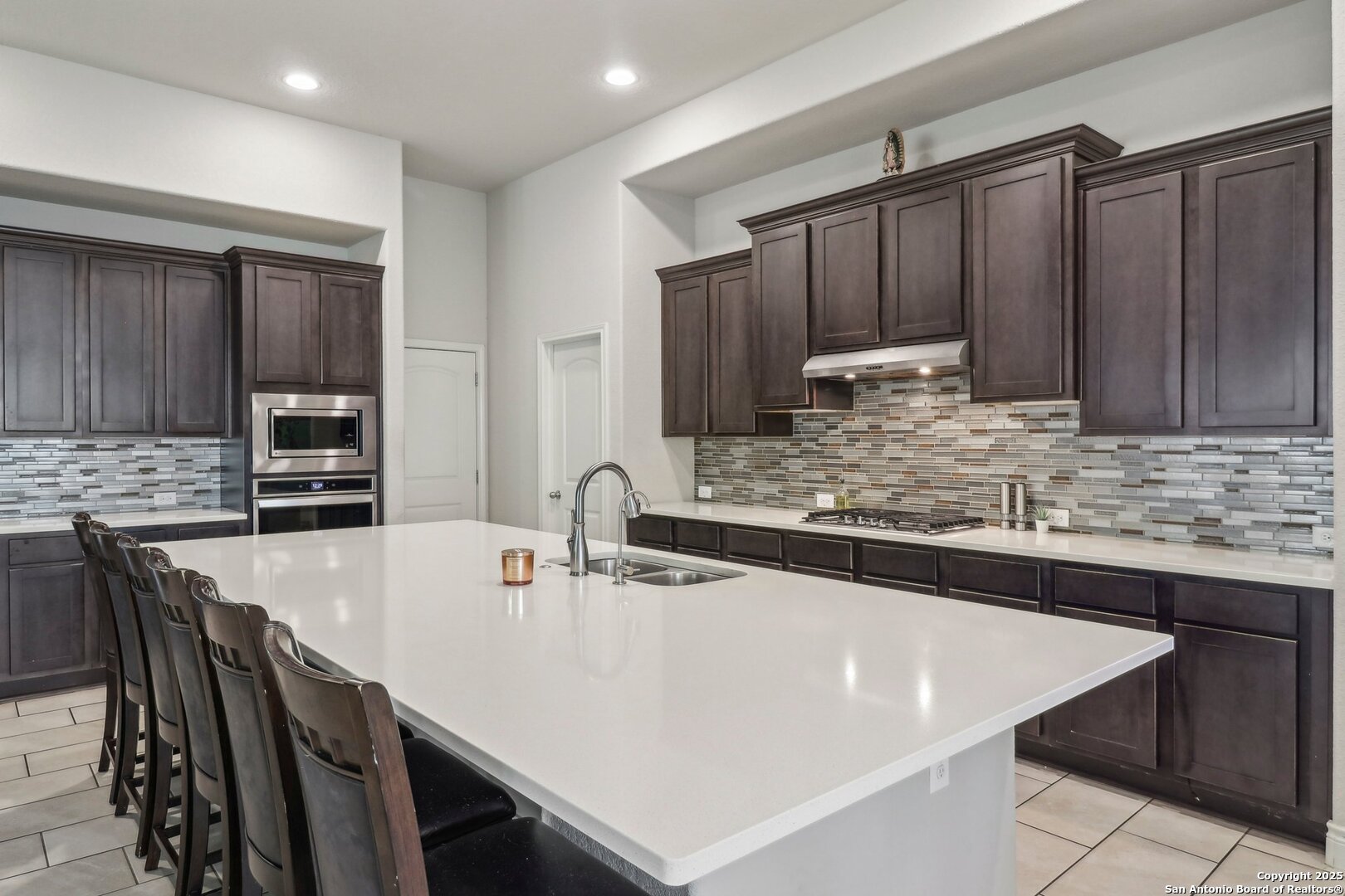 28115 Baldacci Vista Boerne, TX 78015 - Photo 4 of 18 a kitchen with stainless steel appliances a sink and a refrigerator