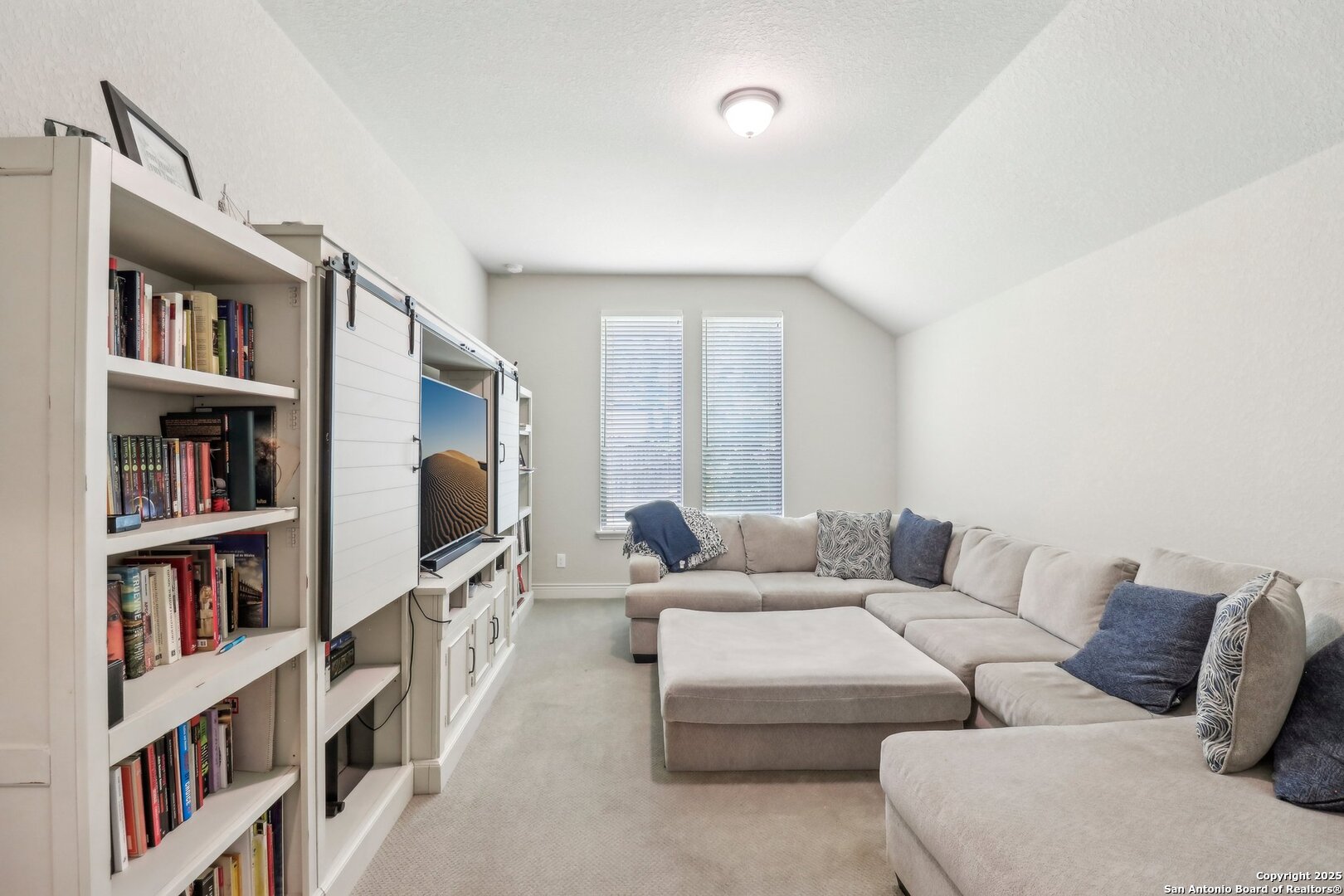 28115 Baldacci Vista Boerne, TX 78015 - Photo 7 of 18 a living room with furniture and a book shelf