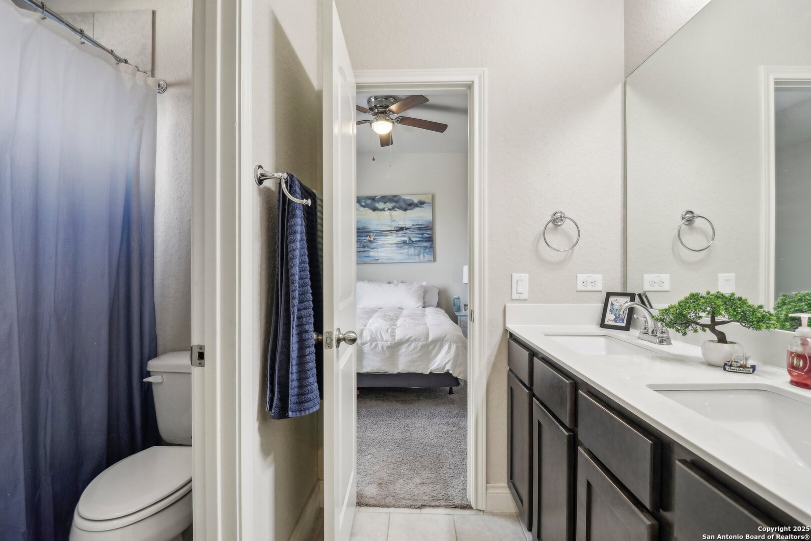 28115 Baldacci Vista Boerne, TX 78015 - Photo 10 of 18 a en suite bathroom with a granite countertop sink and a mirror