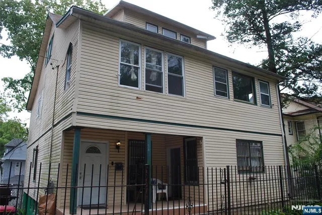 a view of a house with a garage