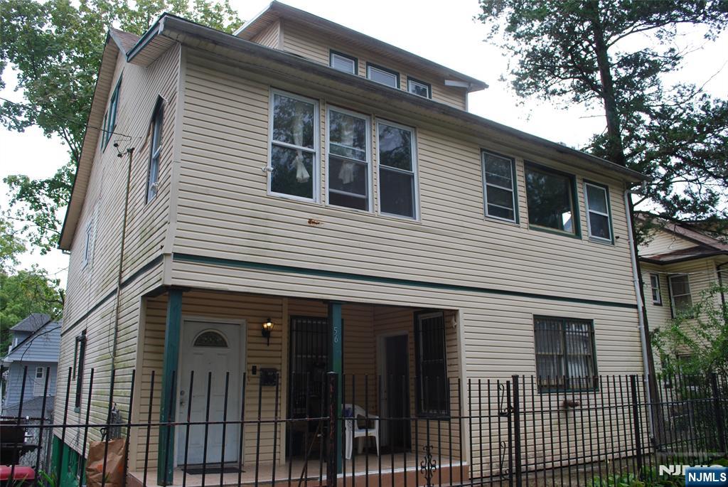 56-58 Pine Grove Terrace, Unit UPPR Newark, NJ 07106 - Photo 1 of 7 a view of a house with a garage