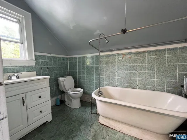 a bathroom with a bathtub and sink