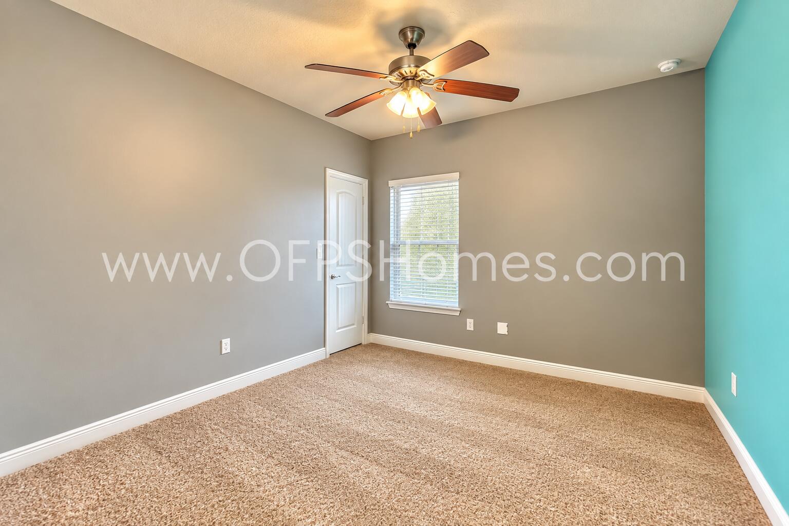 3445 Brownstone Road Crestview, FL 32539 - Photo 11 of 21 Bright Neutral Bedroom with Teal Accent