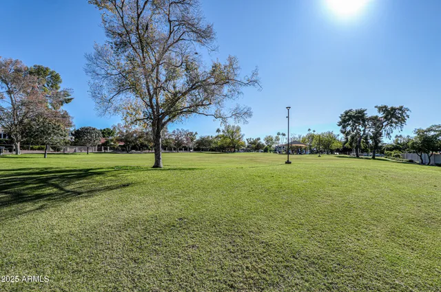 an aerial view of multiple houses with yard