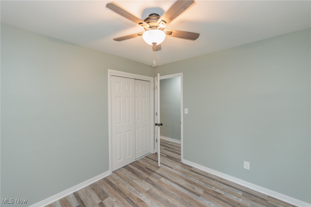 952 Murray Road South Euclid, OH 44121 - Photo 15 of 30 Unfurnished bedroom featuring a closet, light hardwood / wood-style floors, and ceiling fan
