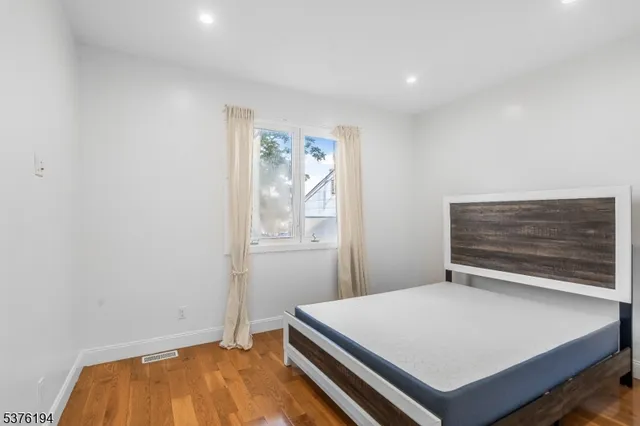 a room with a bed and a window