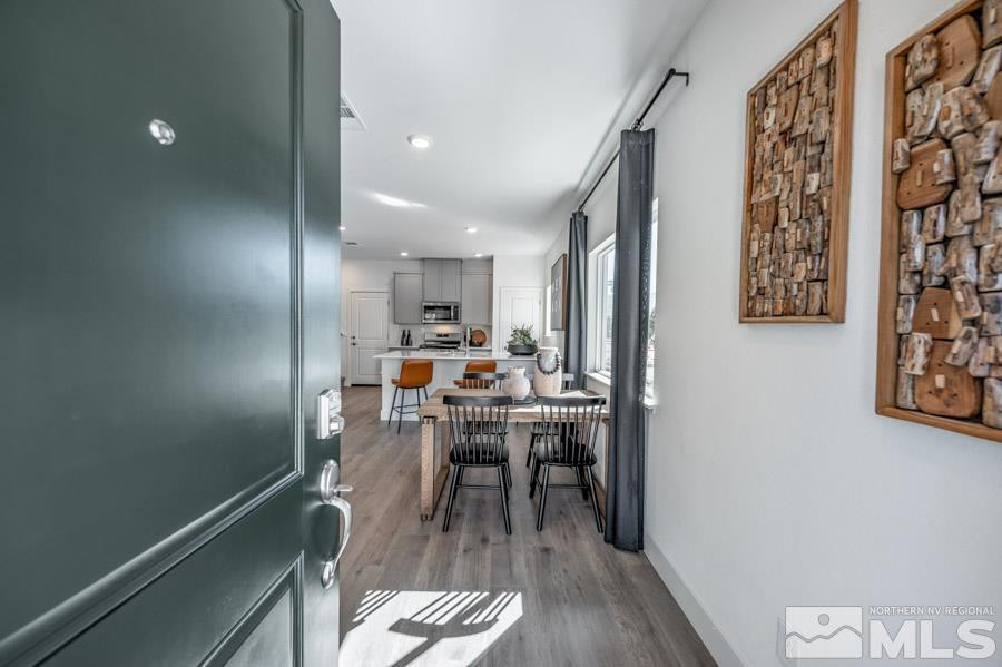 1621 Switchback Street, Unit LOT #25 Reno, NV 89523 - Photo 2 of 19 a view of a dining room with furniture window and wooden floor
