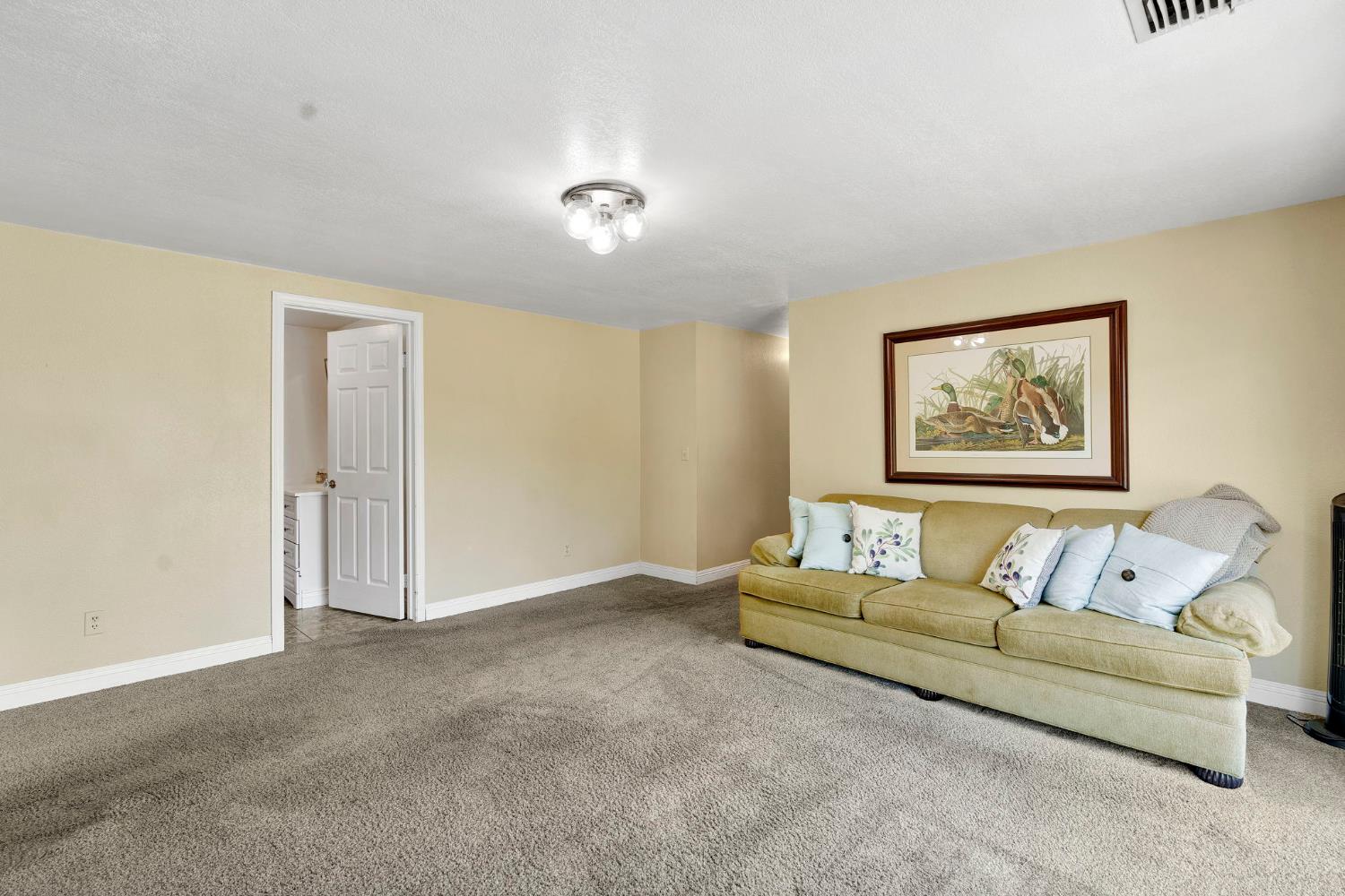 200 Lyons Street Madera, CA 93638 - Photo 21 of 32 a living room with furniture and a window