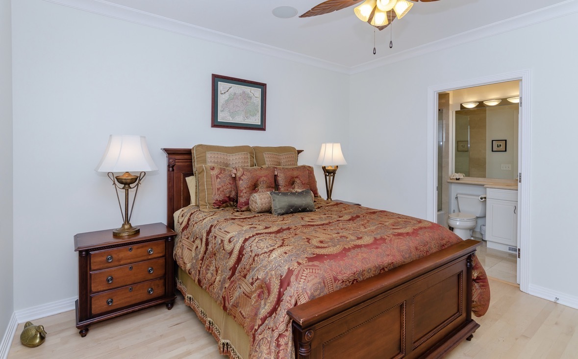 1125 West Monroe Street Chicago, IL 60607 - Photo 25 of 49 a bedroom with a bed and a lamp on table