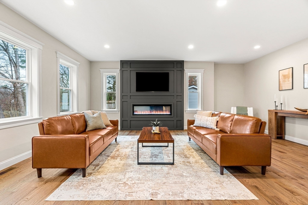 40 Boston Road Andover, MA 01810 - Photo 11 of 42 a living room with furniture and a flat screen tv