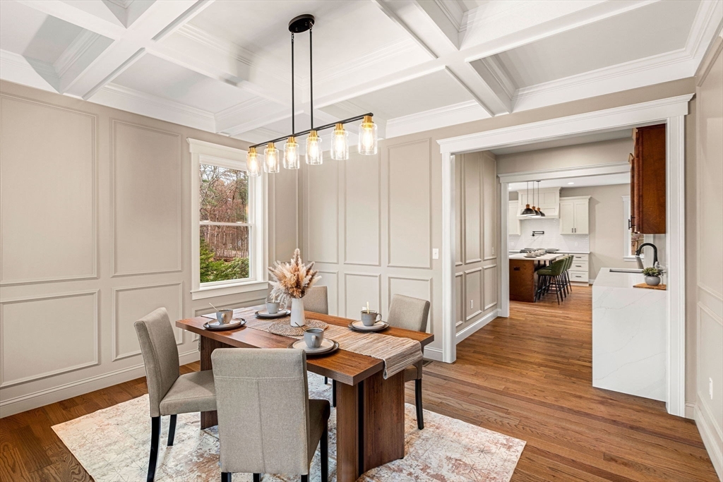 40 Boston Road Andover, MA 01810 - Photo 3 of 42 a view of a dining room and livingroom with furniture wooden floor a chandelier