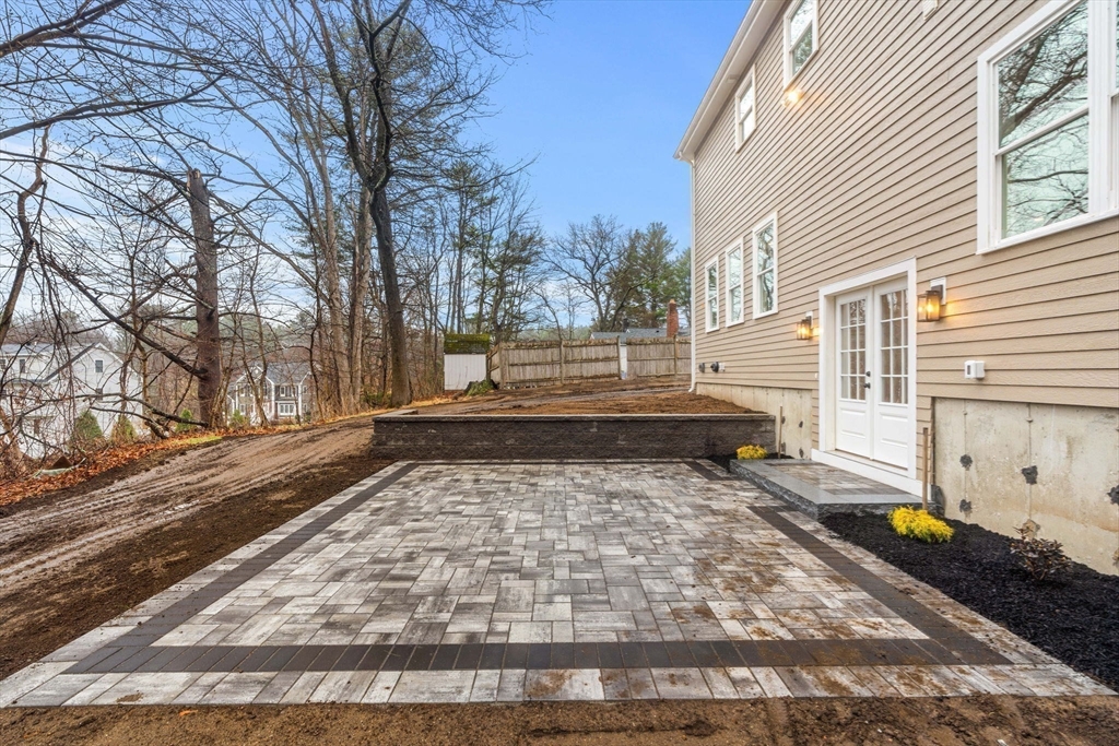 40 Boston Road Andover, MA 01810 - Photo 36 of 42 a view of a yard with wooden fence and trees