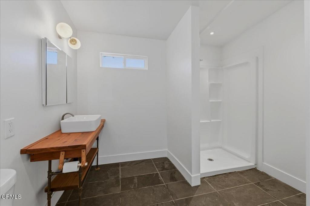 61714 Commercial Street Joshua Tree, CA 92252 - Photo 13 of 42 a room with furniture and a table