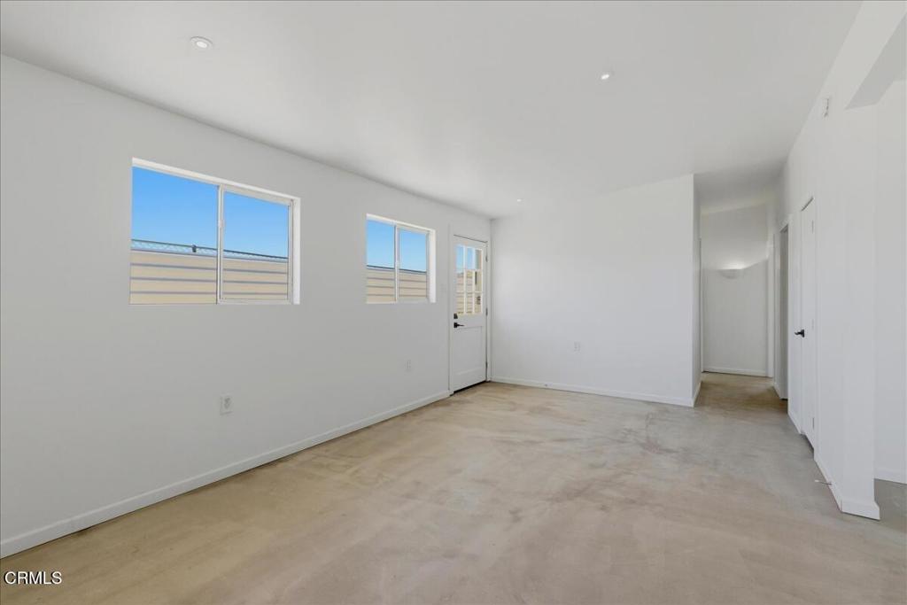 61714 Commercial Street Joshua Tree, CA 92252 - Photo 17 of 42 an empty room with windows