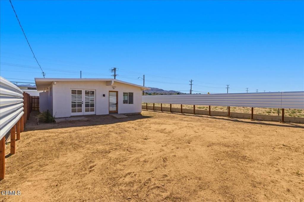 61714 Commercial Street Joshua Tree, CA 92252 - Photo 25 of 42 a view of a house with a yard