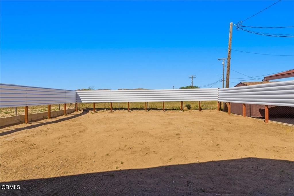 61714 Commercial Street Joshua Tree, CA 92252 - Photo 27 of 42 a view of a swimming pool with outdoor seating and yard