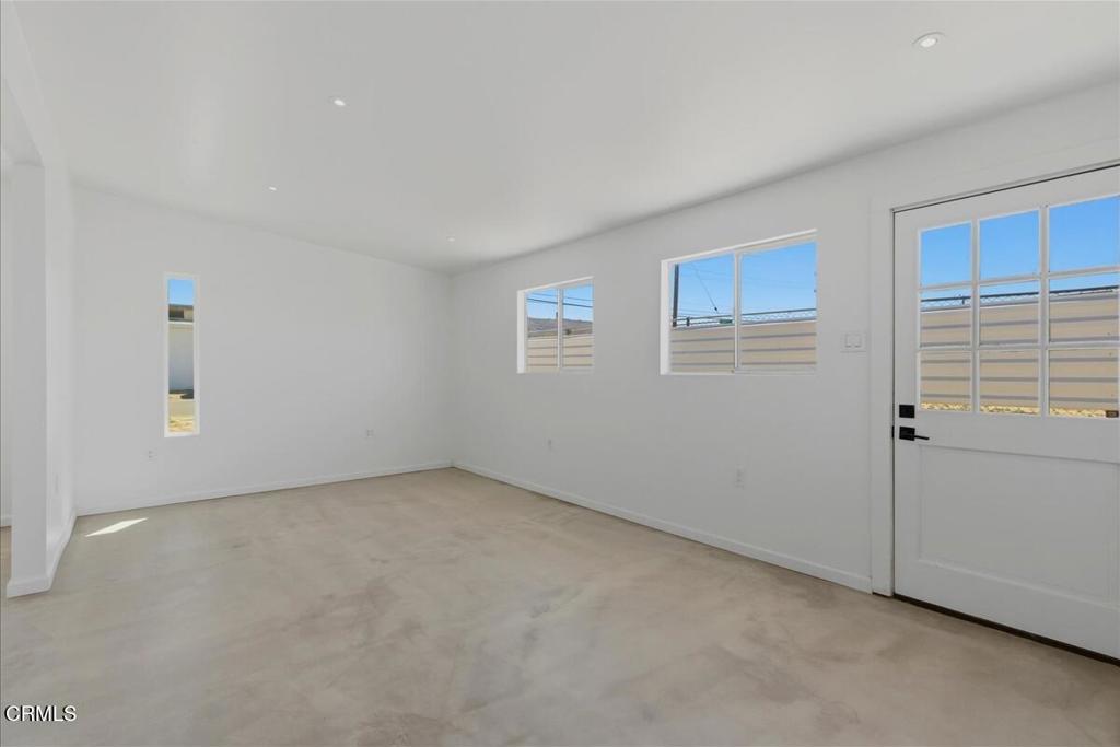 61714 Commercial Street Joshua Tree, CA 92252 - Photo 5 of 42 a view of an empty room with a window