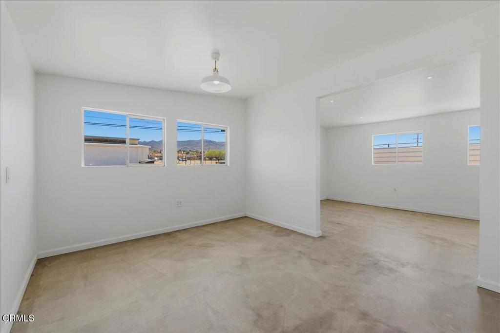 61714 Commercial Street Joshua Tree, CA 92252 - Photo 6 of 42 an empty room with windows