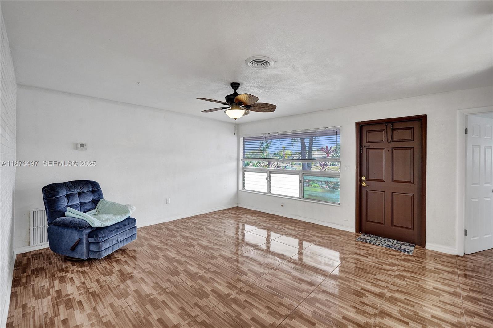 3330 Taft Street Hollywood, FL 33021 - Photo 17 of 70 a view of a livingroom with wooden floor and a window