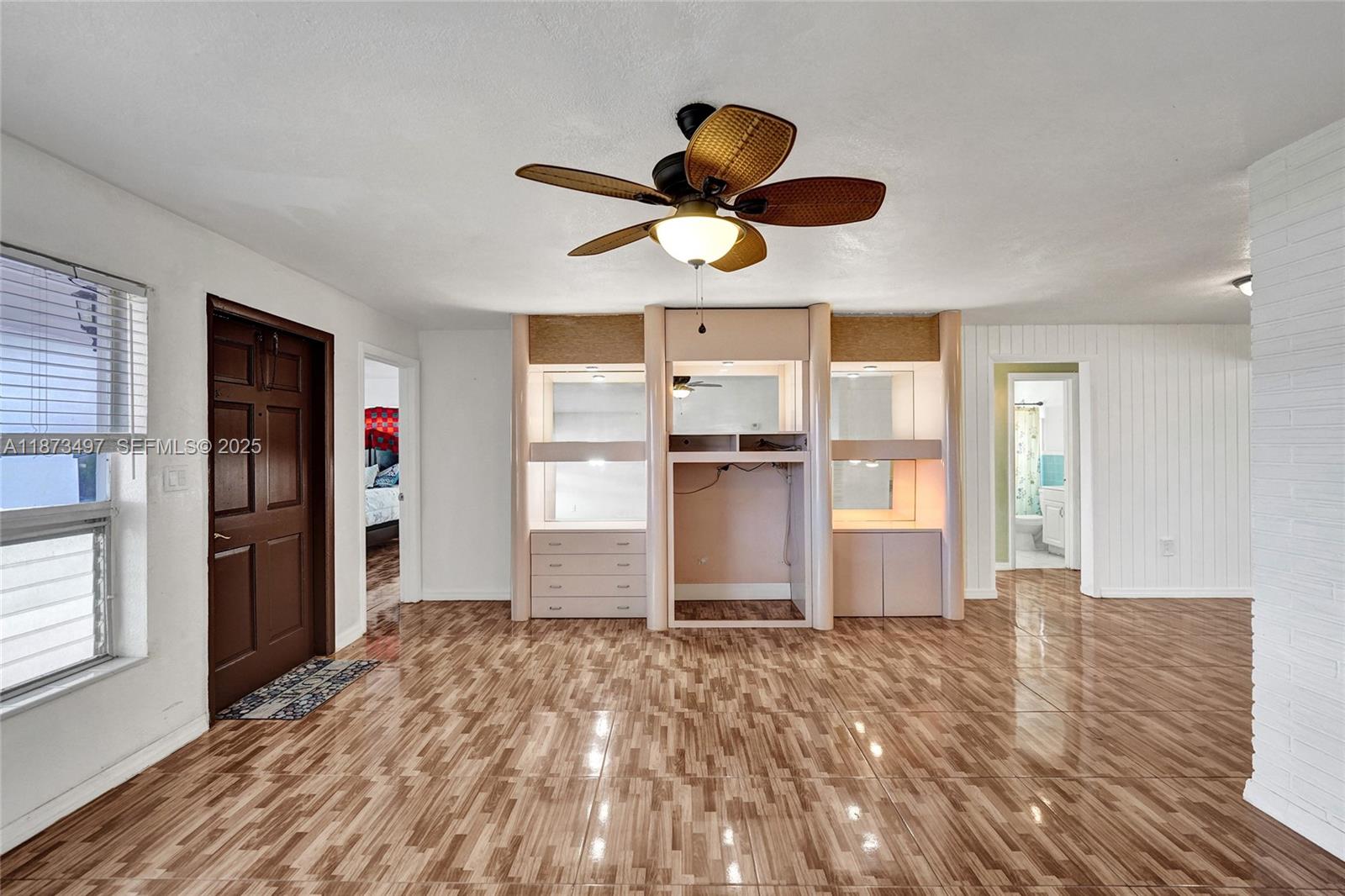 3330 Taft Street Hollywood, FL 33021 - Photo 20 of 70 a view of empty room with wooden floor and window